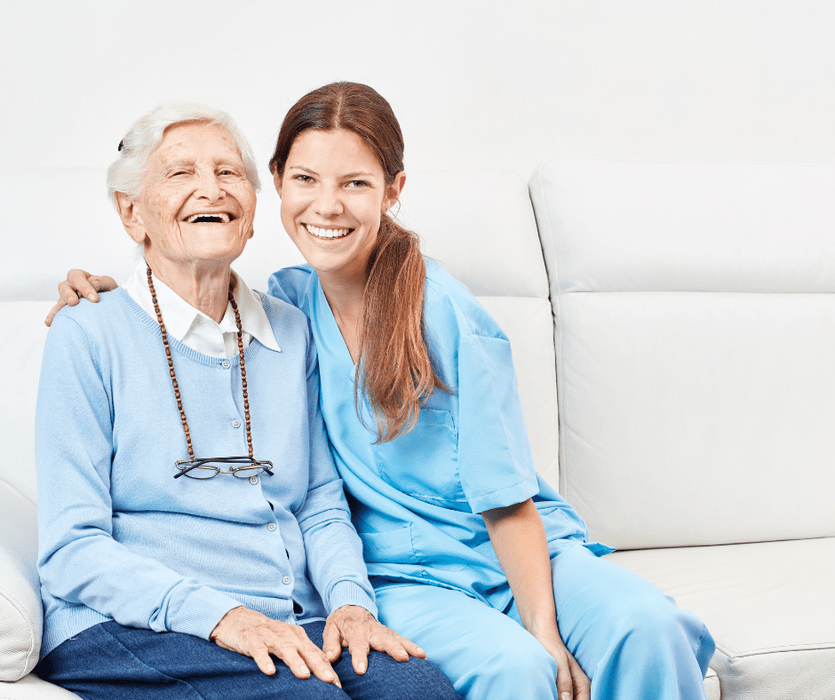 A woman and an old man sitting on the couch