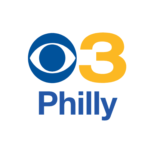 A blue and yellow logo for cbs philly.